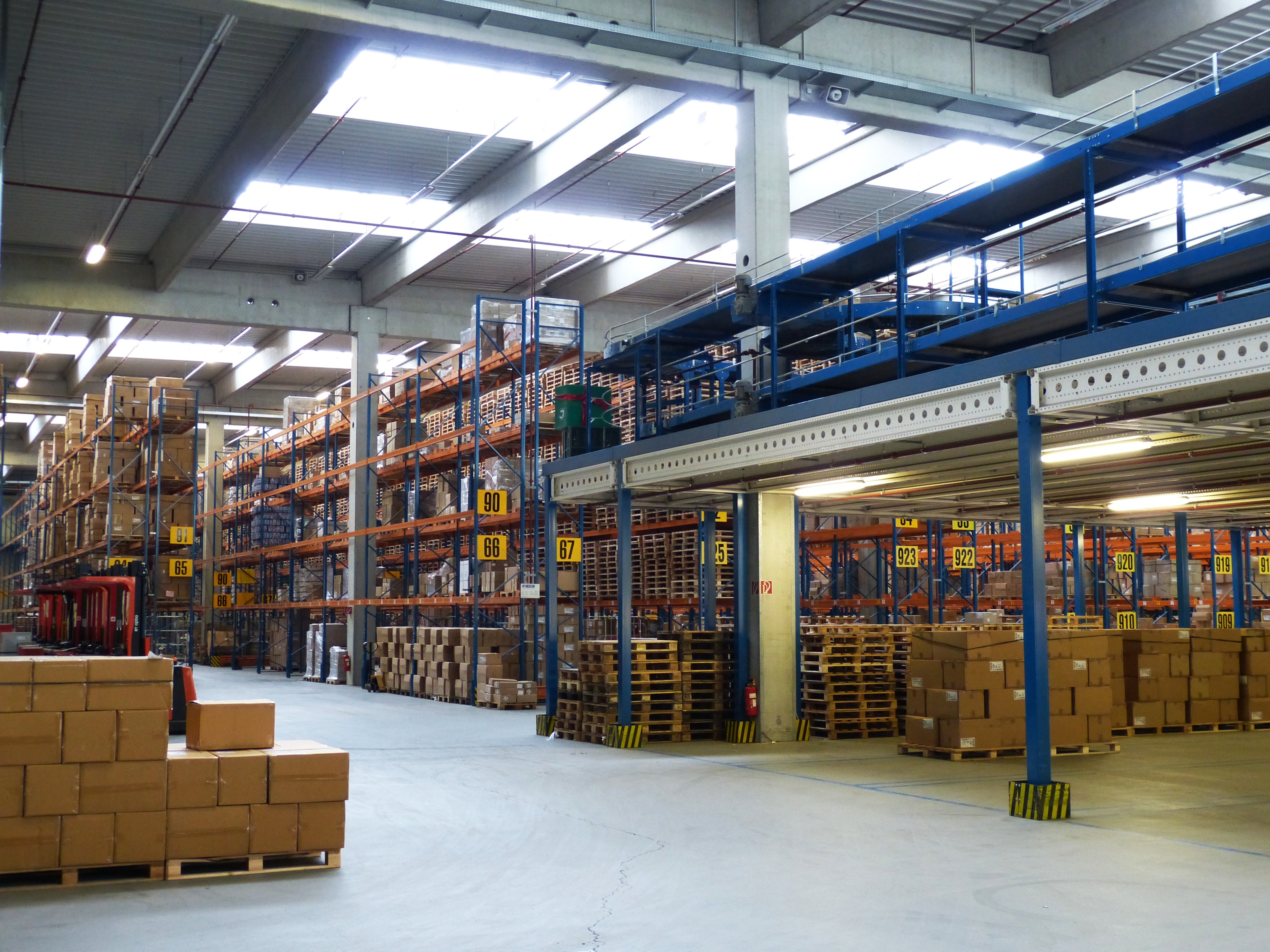 Industrial warehouse with production lines and pallet storage